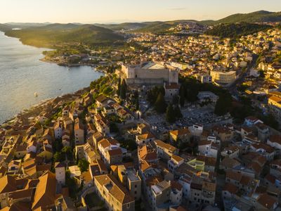Beautiful old city of Sibenik, aerial view of the town center at sunset. Croatia