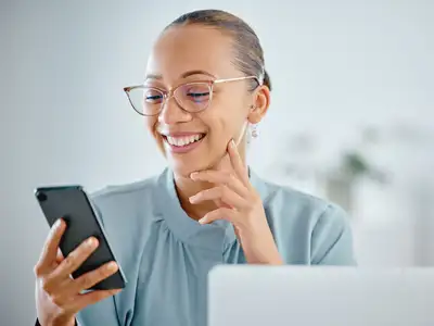 Smiling, excited and happy business woman texting, browsing and reading notification on phone with